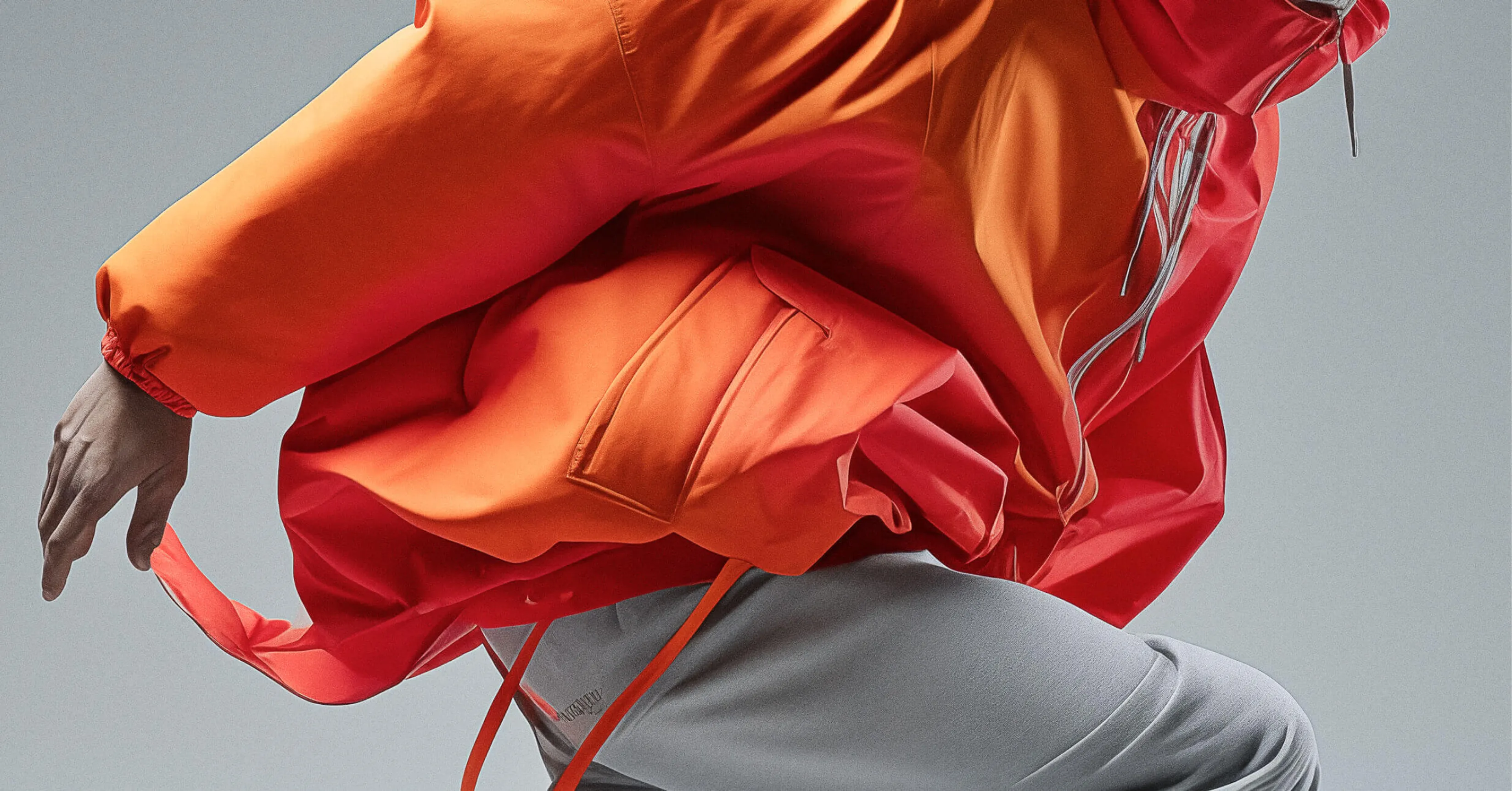 a man wearing a orange coat